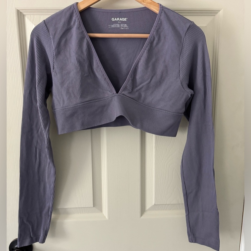 Garage clothing store purple cropped long sleeve v shaped ribbed top